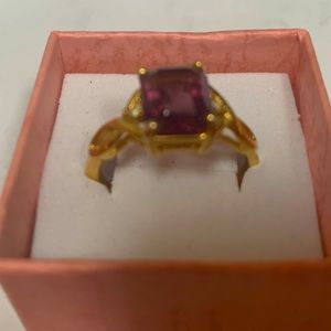 Rings...simulated amethyst gold tone nib